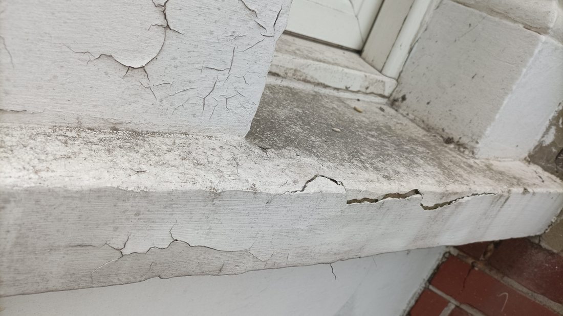 Exterior windowsill before repainting